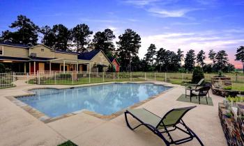 Enjoy yourself out by our saltwater pool, surrounded by acres of grass and trees